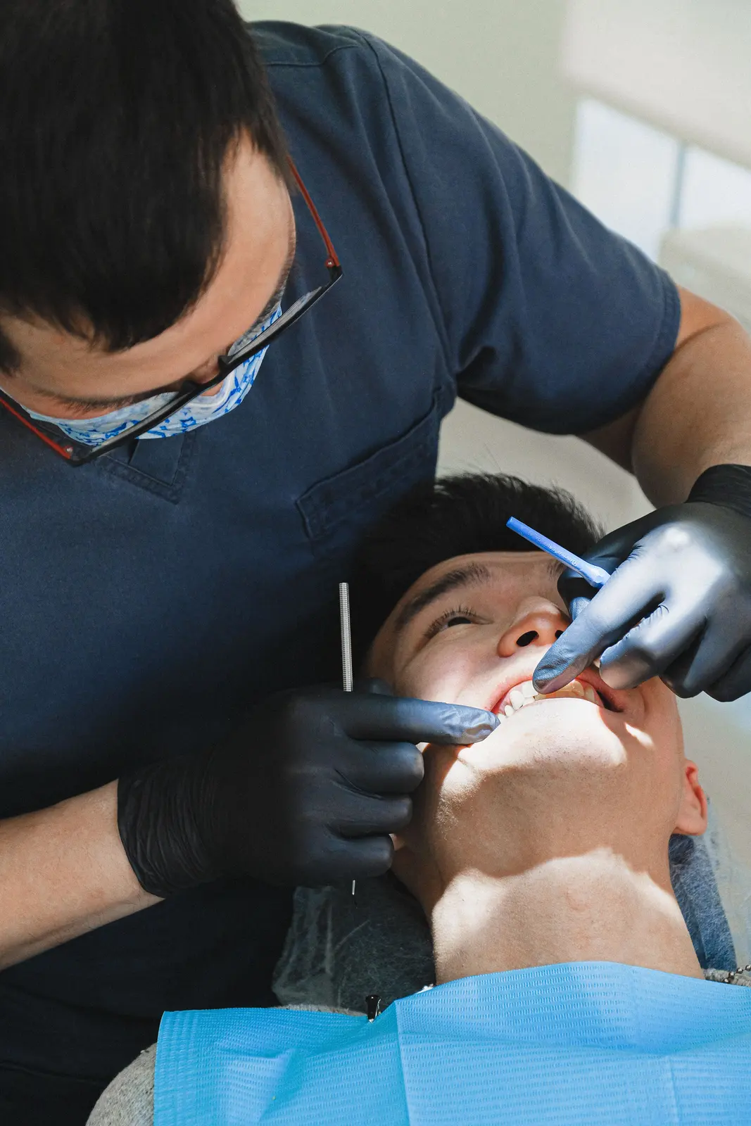 Careful chairside work on a single tooth, alongside the Implants In Winkler explanation in Winnipeg