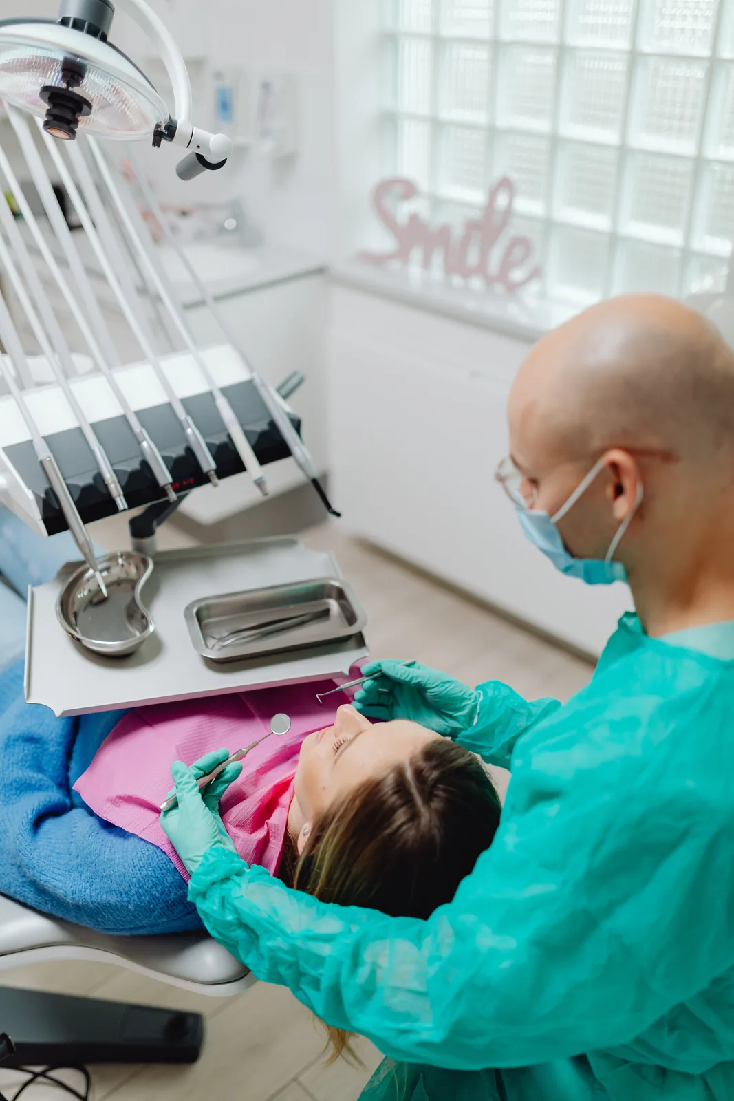 Chairside treatment with a sterile instrument tray, alongside the Full Mouth Restoration explanation in Winnipeg