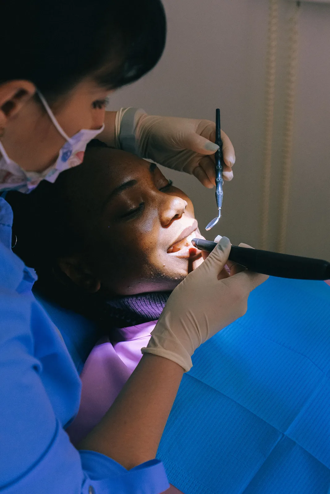 Curing light used during a restoration, referred to in the Implants In Winkler section for Winnipeg