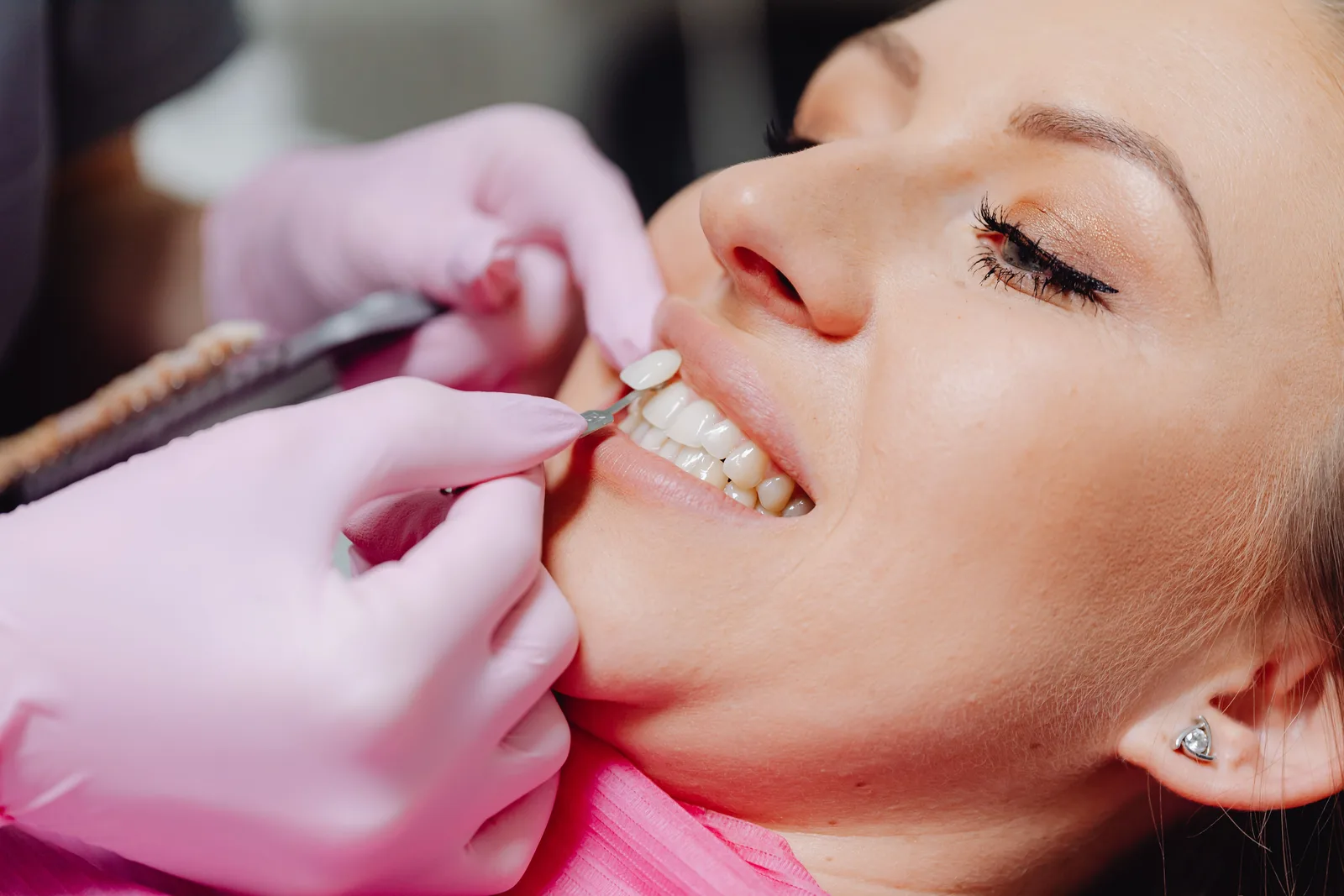 Checking gum health around the teeth, alongside the Tooth Extraction Implant explanation in Winnipeg
