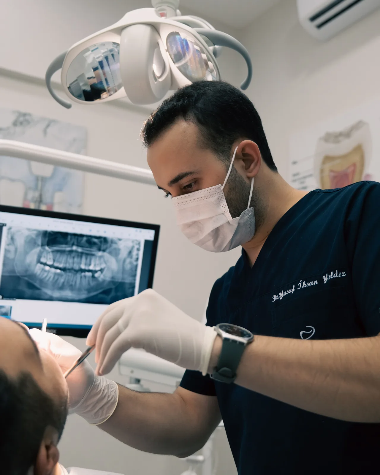 Implant planning from a panoramic X-ray, alongside the Implants Vs Bridge explanation in Winnipeg