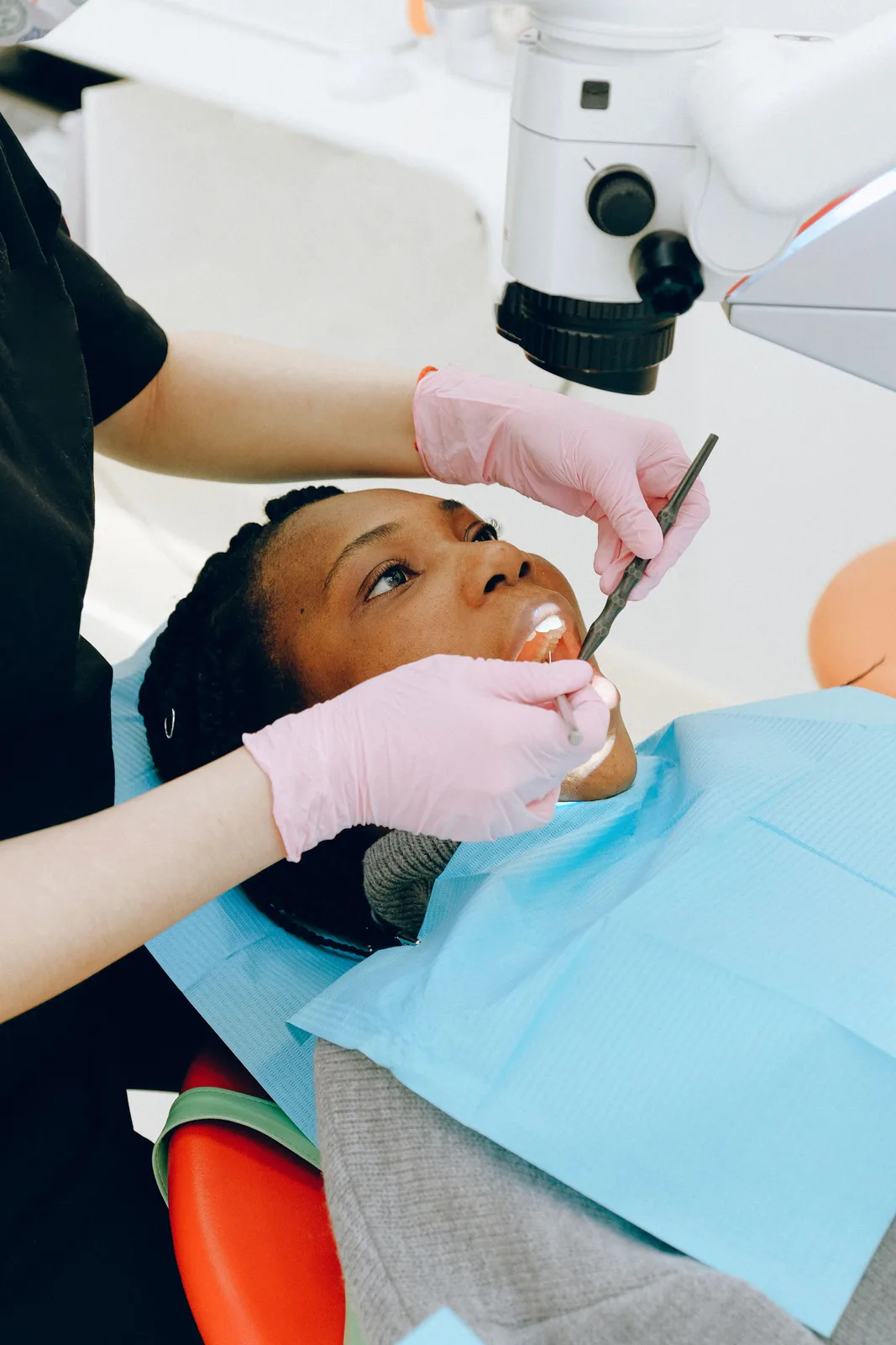 Microscope assisted dental treatment, shown while covering Front Tooth Implant in Winnipeg