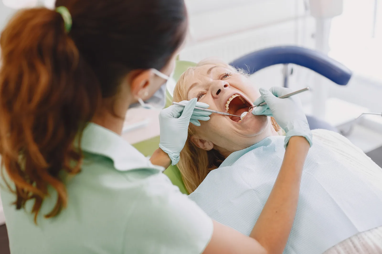 Oral exam before implant planning, alongside the Implant Consultation explanation in Winnipeg