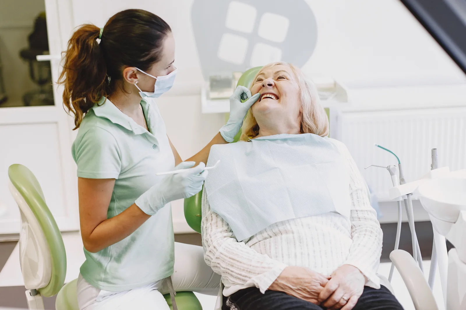 Patient at ease during a dental checkup, shown while covering Single Implant Cost in Winnipeg