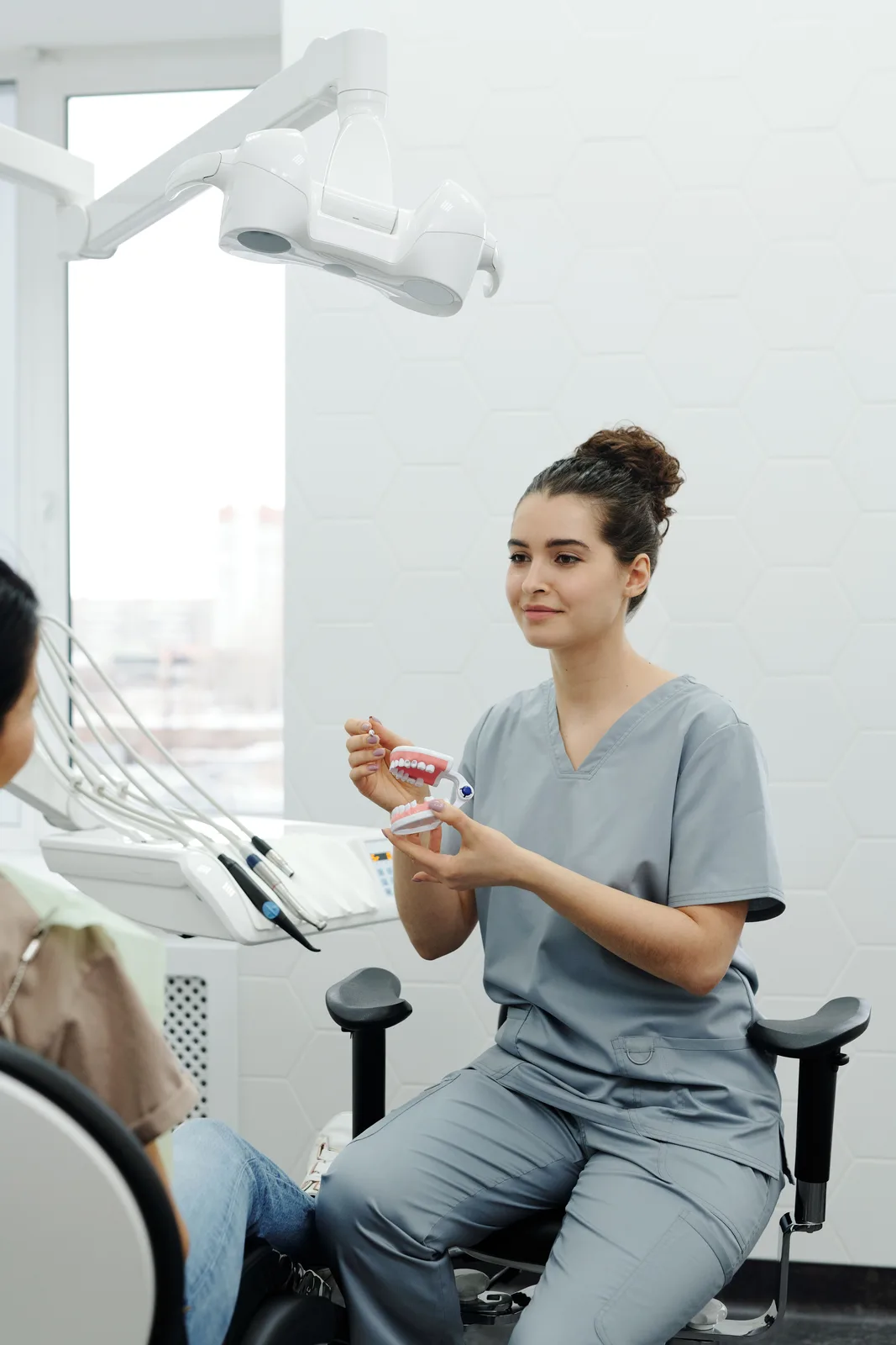 Treatment explained chairside in the operatory, shown while covering Bone Grafting in Winnipeg