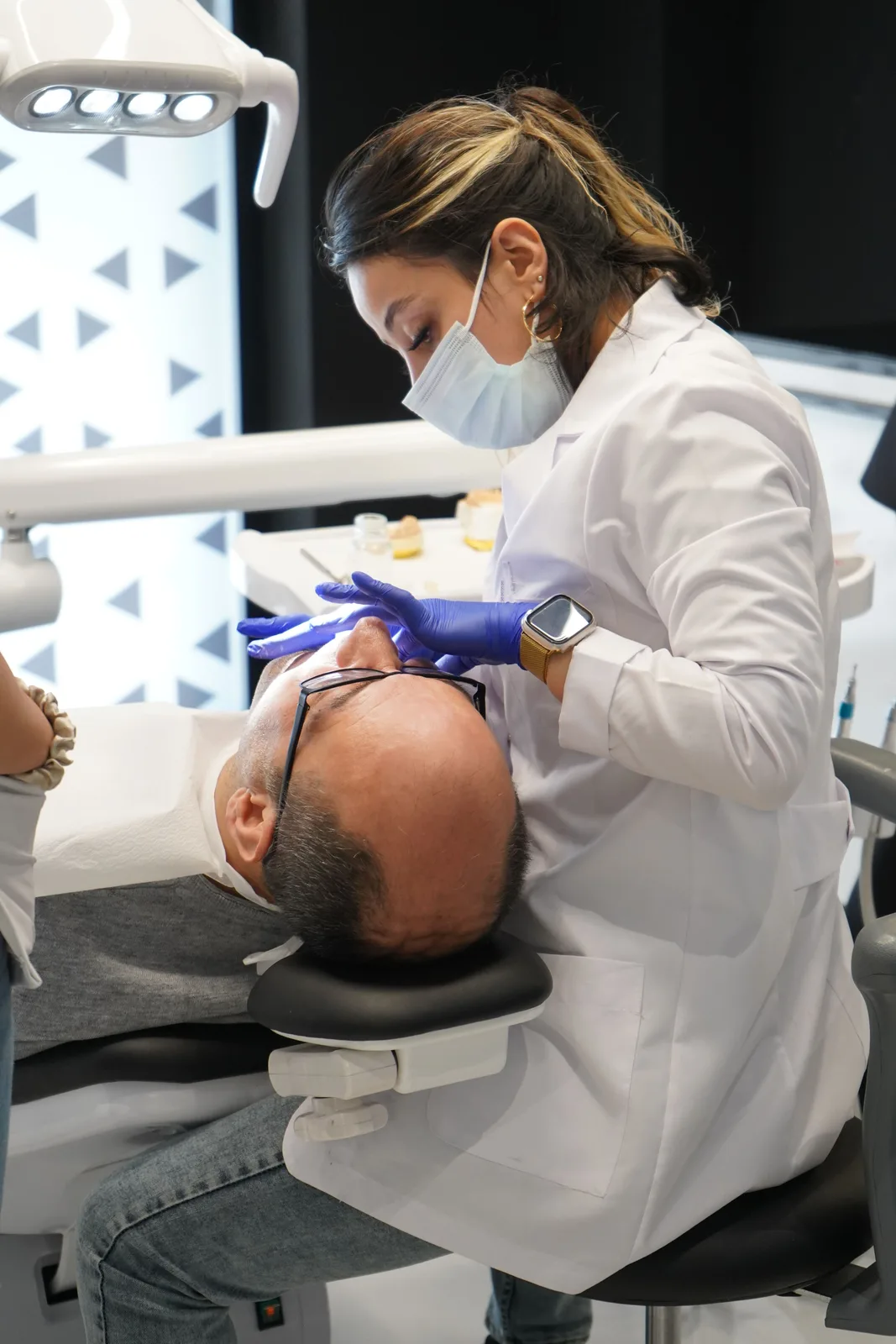Treatment in a modern operatory, shown while covering Implants In Winkler in Winnipeg